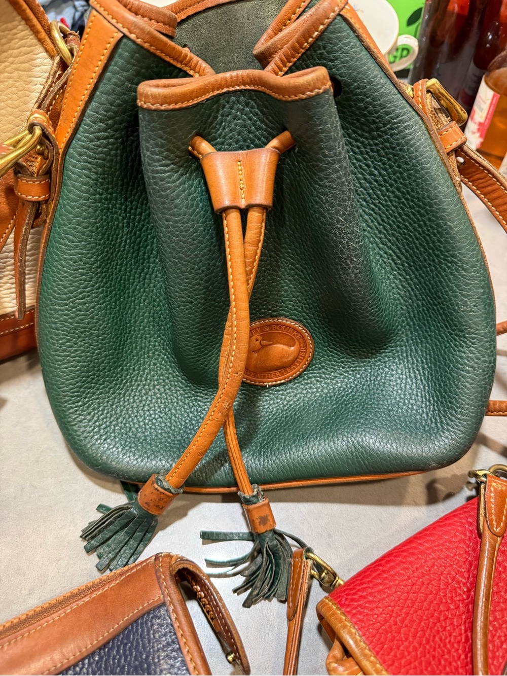 Dooney & Bourke Forest Green Pebbled Leather Drawstring Bucket Bag with Tan Trim